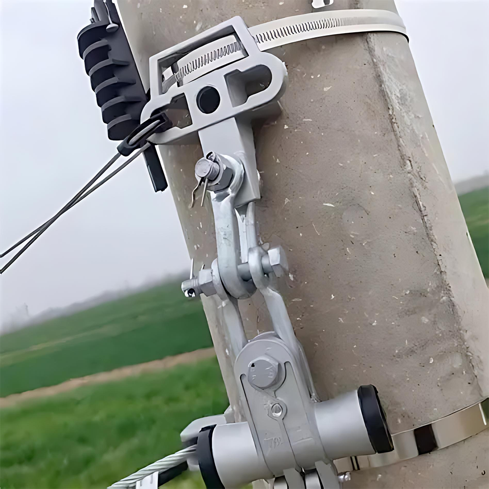 A UPB Pole Bracket is installed on a concrete pole, supporting a suspension clamp and an aerial cable