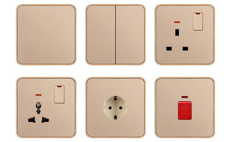 Six golden-colored electrical fittings, including an EU switch and socket, double switch, multi-pin sockets, and a single red switch
