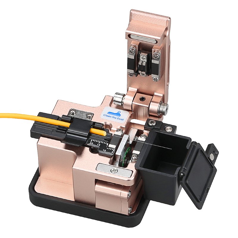 Three-in-one Fiber Cleaver with a yellow fiber optic cable inserted, showcasing its blade, fiber holder, and open scrap collector