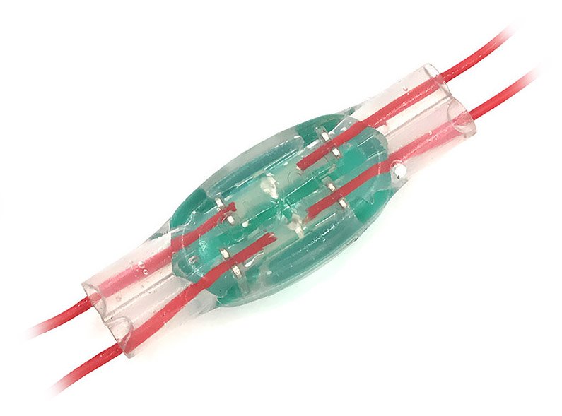 a U1B Inline Connector used to join two red electrical wires