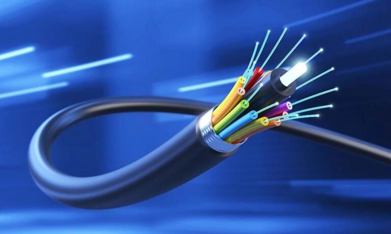 a cut Fiber Optic Cable with individual colored strands transmitting ligh