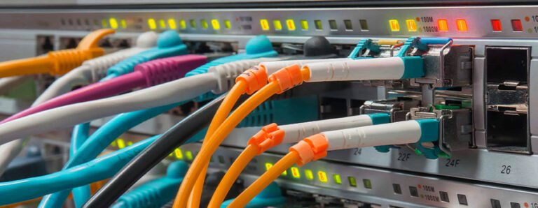 Colorful patch cords connected to a telecom equipment panel, essential for Telecom Connectivity