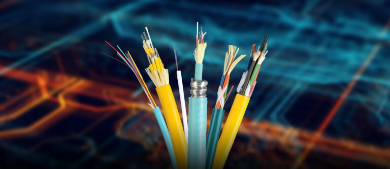 Fiber optic cables, including various types of indoor fiber cable, with their internal structures visible