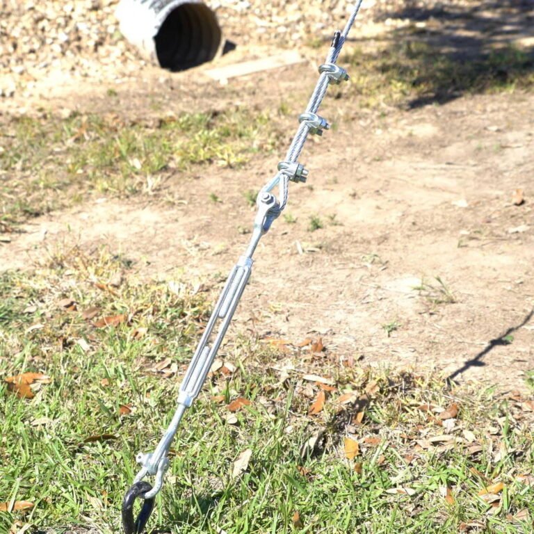 a guy wire system showing a Turnbuckle connected to a heavy-duty Bow Stay Rod Assembly anchored near the ground